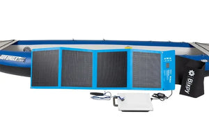 Blue Bixpy 80W solar panel, white K-1 motor, and black storage bag in front of a blue Sea Eagle kayak.