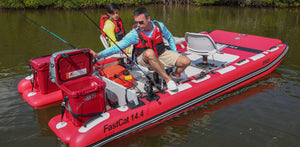 Red Sea Eagle FastCat 14.4 inflatable catamaran with two men fishing, featuring Yeti coolers and swivel seats.