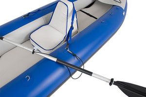 Black Sea Eagle paddle leash with a gold clip attached to a silver paddle on a blue inflatable kayak.