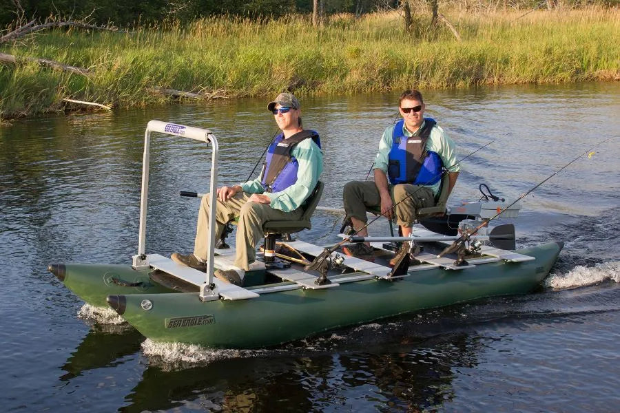 Two men fishing from a green Sea Eagle FoldCat pontoon boat with a 7" pedestal seat.