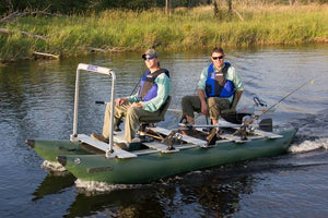Two men fishing from a green Sea Eagle FoldCat pontoon boat with a 7" pedestal seat.