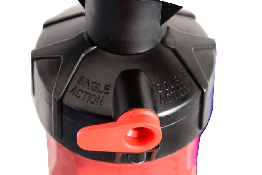 Close-up of a black and red Sea Eagle SUP pump with a red switch for single or double action.