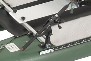 Black Scotty Gear Head track adapter holding a fishing rod on a green Sea Eagle kayak.