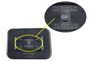 Black rectangular Scotty glue-on mounting pad with a raised center and text, shown with a magnified detail.