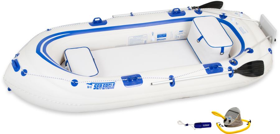 White and blue Sea Eagle 9 inflatable boat with two seats, oars, pump, and repair kit.
