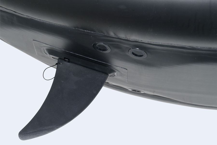 Black Sea Eagle skeg base attached to an inflatable kayak or SUP, showing the fin and mounting holes.