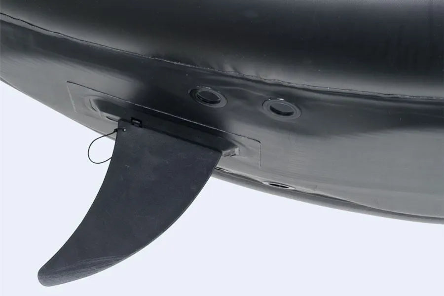 Black Sea Eagle skeg base attached to an inflatable kayak or SUP, showing the fin and mounting holes.