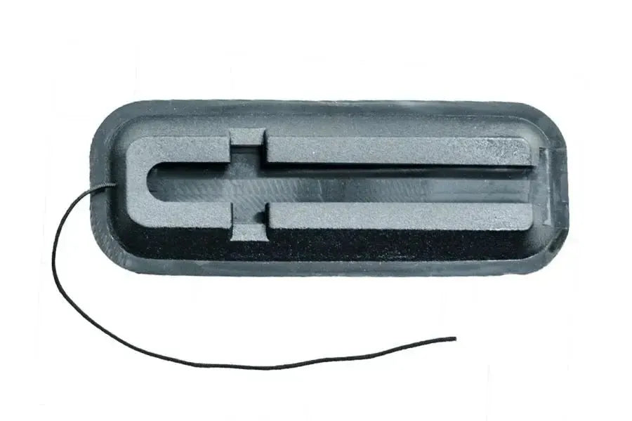 Black rectangular Sea Eagle skeg base with a central groove and attached string for SUPs and kayaks.