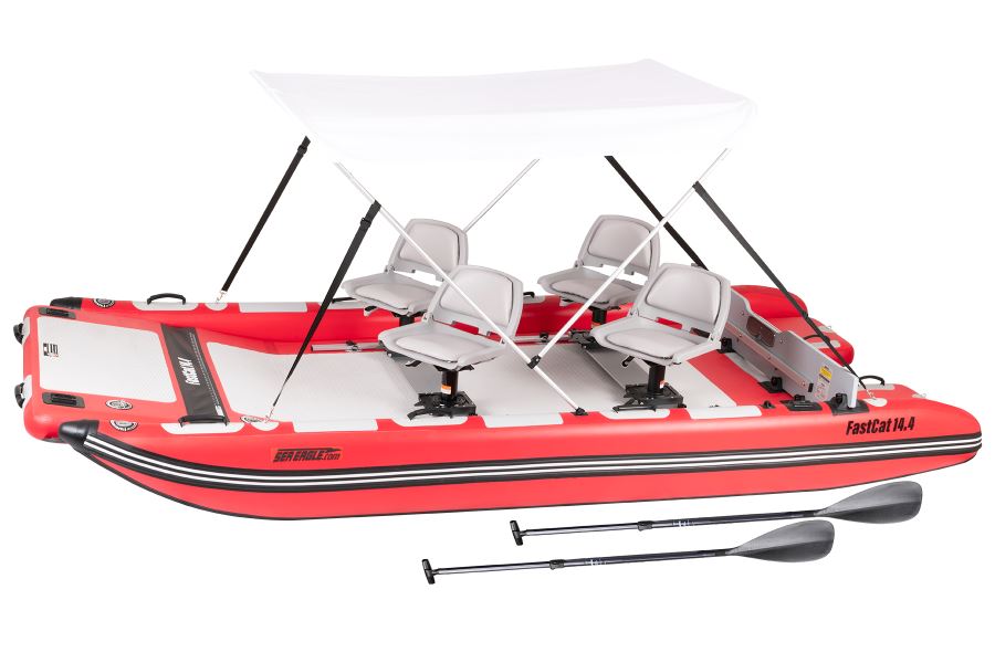 White Sea Eagle Wide Sun & Rain Canopy on an inflatable boat with blue trim and gray seat.