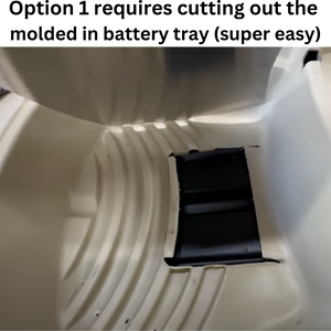 Close-up of a cream boat interior with a rectangular black cutout for a battery tray.