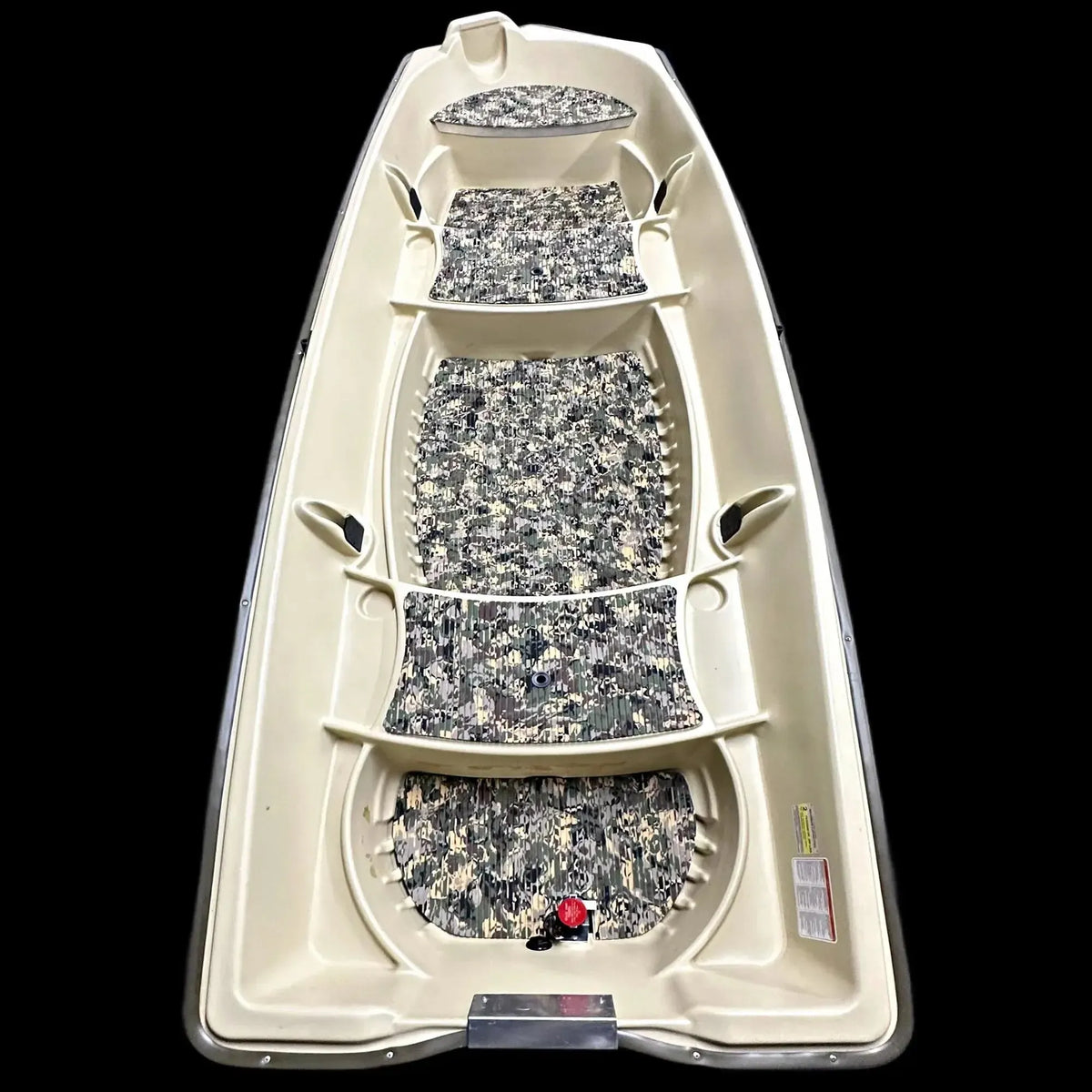 Overhead view of a beige Sun Dolphin American 12 boat with camouflage EVA foam flooring installed.