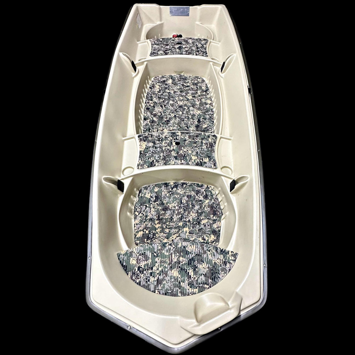 Overhead view of a beige Sun Dolphin American 12 boat with digital camo EVA foam flooring kit installed.