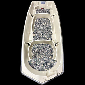 Overhead view of a beige Sun Dolphin American 12 boat with digital camo EVA foam flooring kit installed.