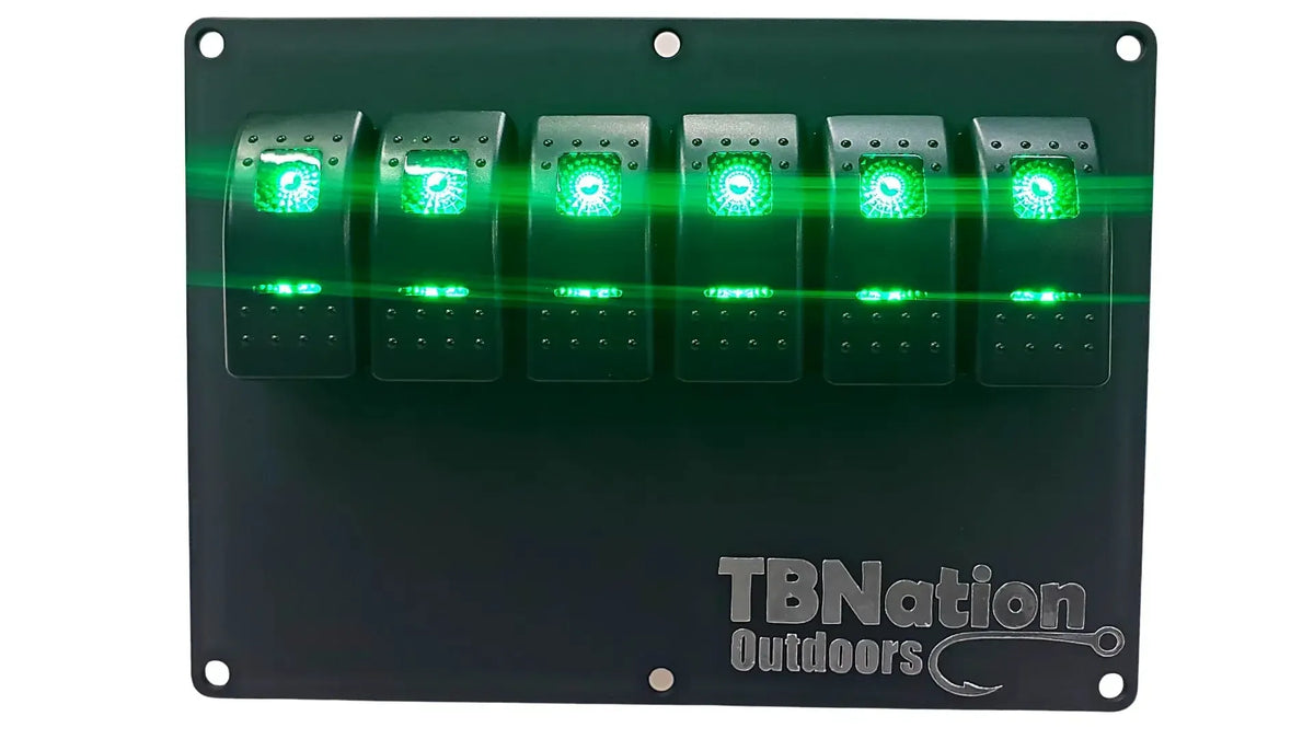 Black TBNation 6-gang hydro-dipped aluminum switch panel with six illuminated green rocker switches.