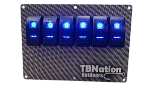 TBNation 6-gang carbon fiber hydro-dipped aluminum rocker switch panel with six illuminated blue switches.