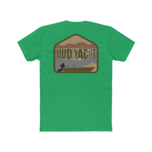 Green "Mud Yacht" t-shirt with a distressed graphic of a boat, mountains, and sky.