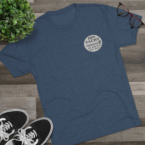 Blue tri-blend tee with "Jon Yacht The Original Bass Boat" logo on chest, styled with sneakers and glasses.