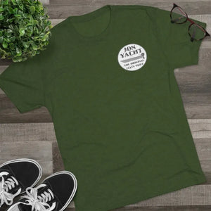 Dark green "Jon Yacht The Original Flats Skiff" graphic tee, soft cotton, with black sneakers and glasses.