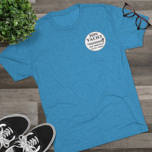 Blue Jon Yacht "The Original Flats Skiff" t-shirt, soft cotton blend, with black sneakers and glasses.