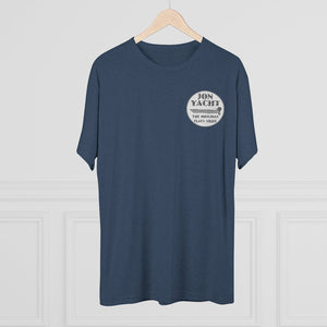 Navy blue "Jon Yacht The Original Flats Skiff" graphic tee on a wooden hanger.