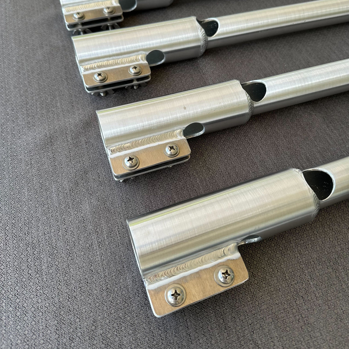 Silver aluminum X-LONG tiller extension handles with precision welds and cut-out for motor kill switch.