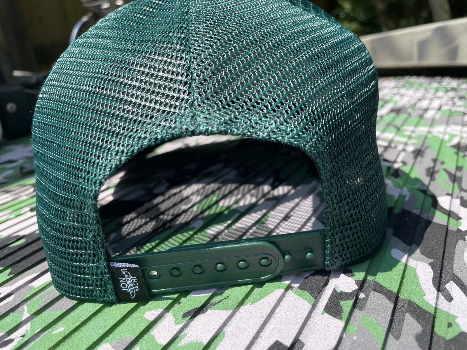 Gray and dark green trucker hat with a brown leather patch featuring "Tiller Mafia" and a boat graphic.