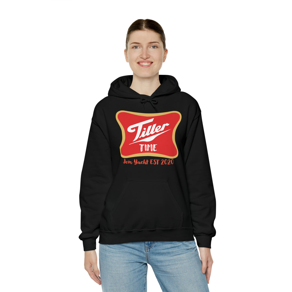 Woman smiling in a black Tiller Time cotton-polyester hoodie with a red and gold logo.