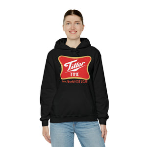 Woman smiling in a black Tiller Time cotton-polyester hoodie with a red and gold logo.