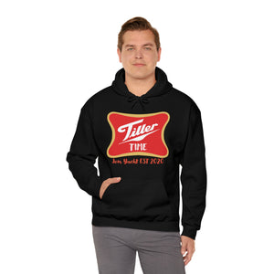 Man wearing a black Tiller Time hoodie with a red and gold graphic, kangaroo pocket, and drawstring hood.