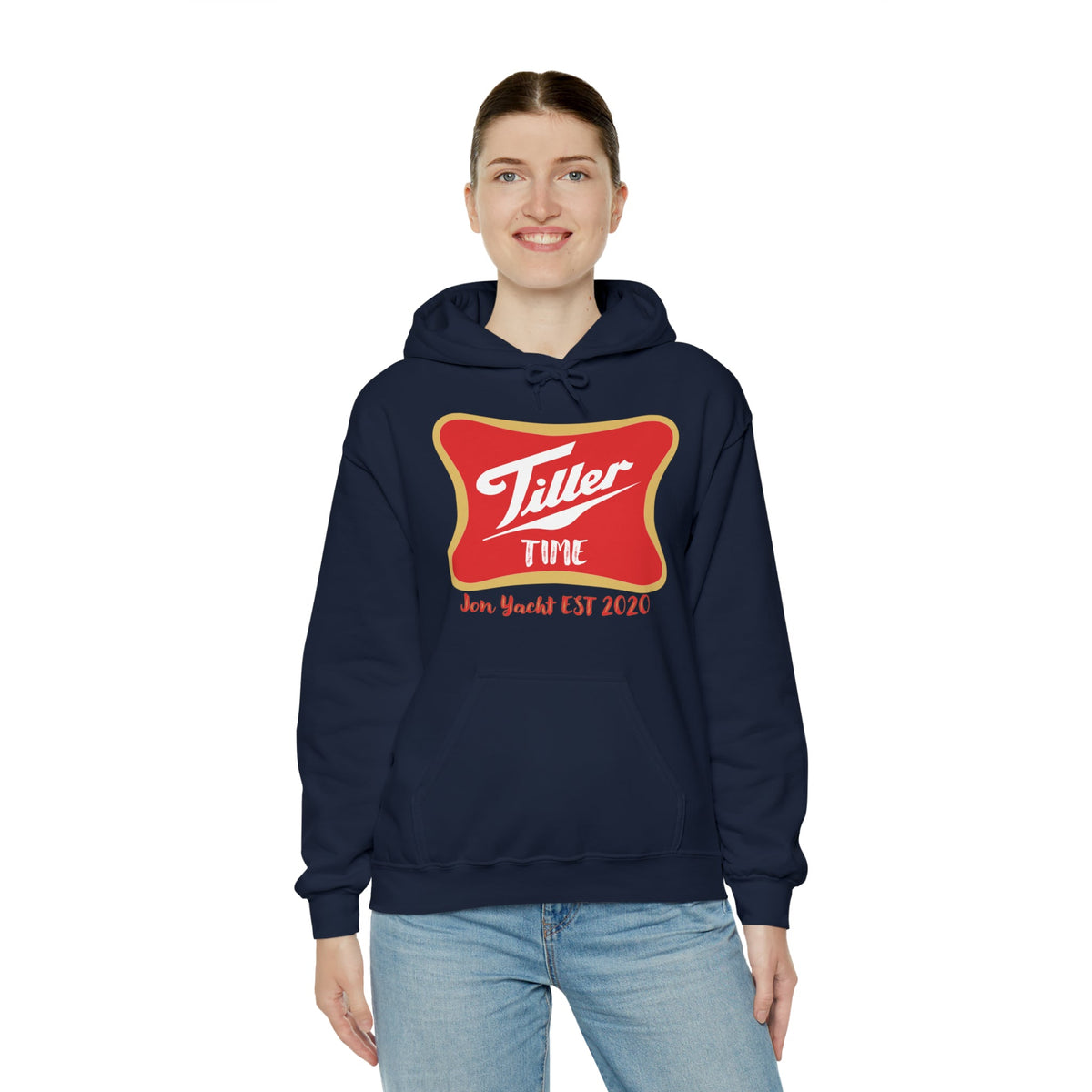 Smiling woman in a navy Tiller Time hoodie with a red and gold graphic, kangaroo pocket, and drawstring hood.