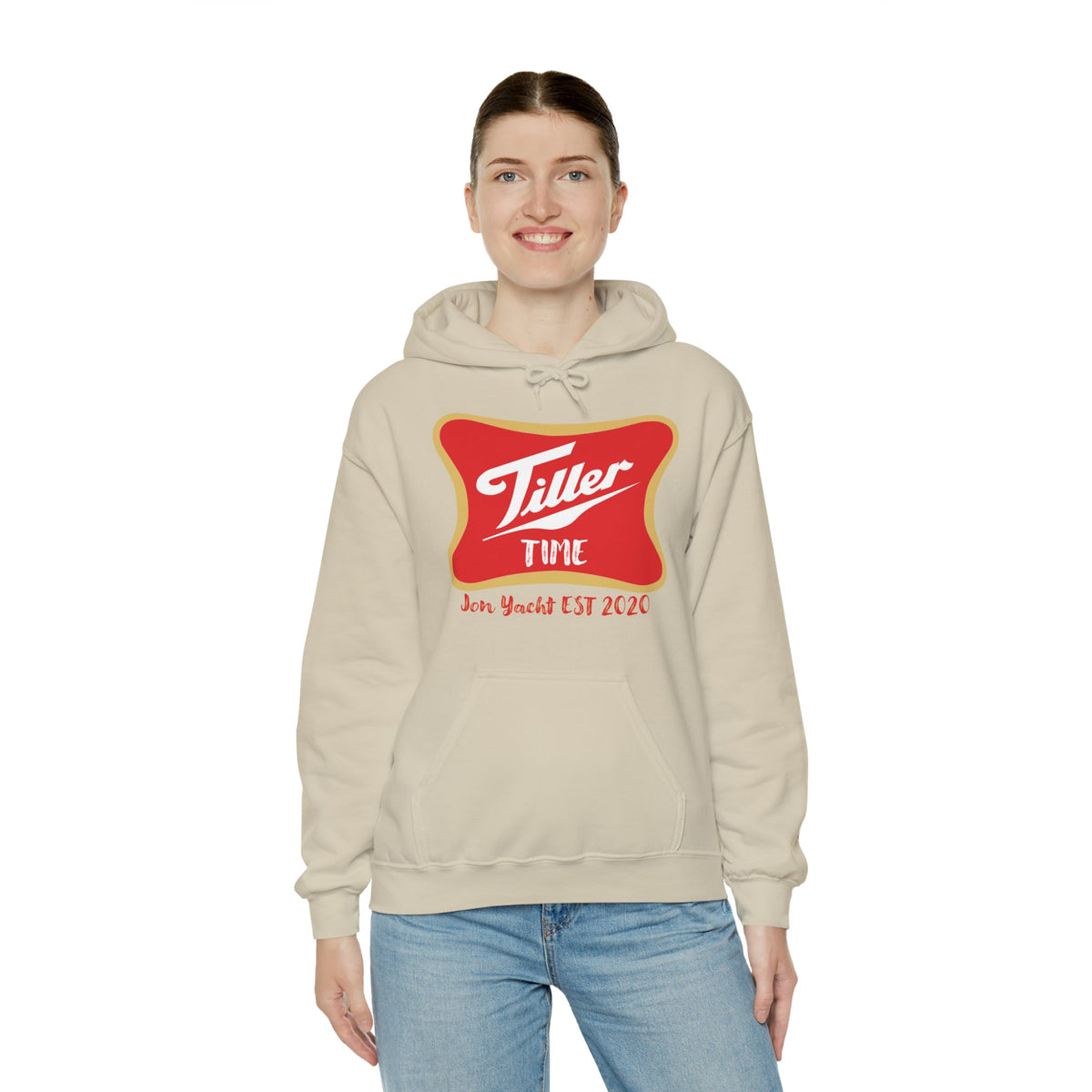 Woman smiling in a beige "Tiller Time" cotton-polyester hoodie with a red and gold graphic.