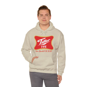 Man wearing a beige Tiller Time cotton-polyester hoodie with a red and gold graphic and kangaroo pocket.
