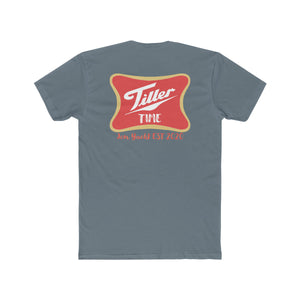 Slate blue combed cotton T-shirt with a red and gold "Tiller Time Jon Yacht EST 2020" graphic on the back.