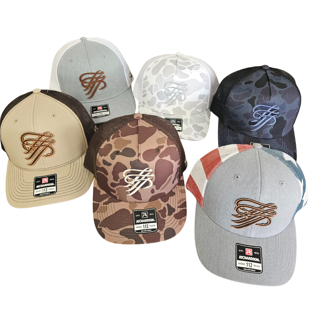 Six Richardson 112 trucker hats: tan, grey, two camo, black camo, and grey with red/white/blue stripes. All feature a "TTP" logo.