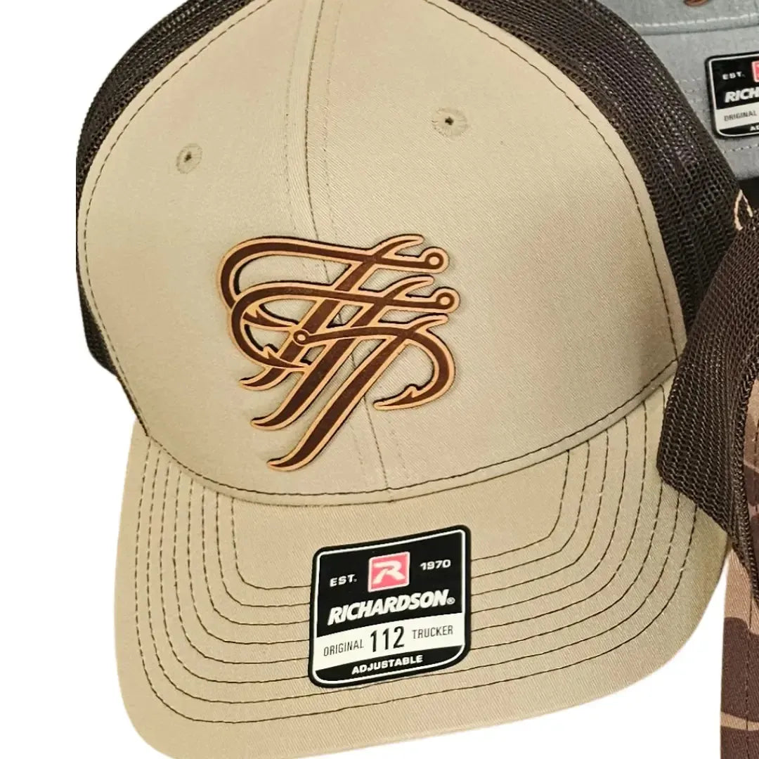 Tan Richardson 112 Trucker hat with brown mesh back and a brown fishing hook logo.