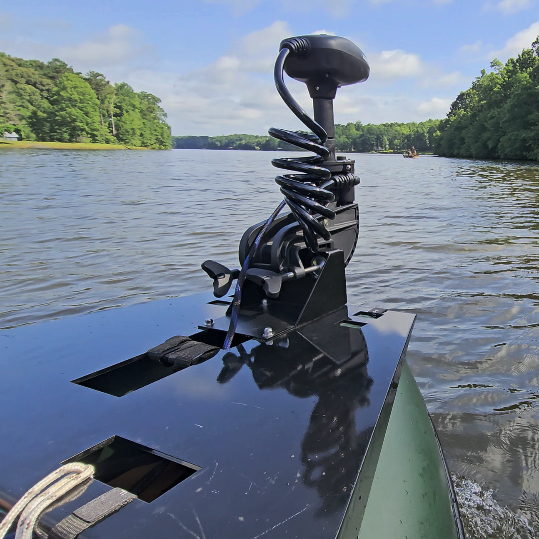 Black universal clamp-on trolling motor mount on a boat bow, with a motor attached, on a lake.