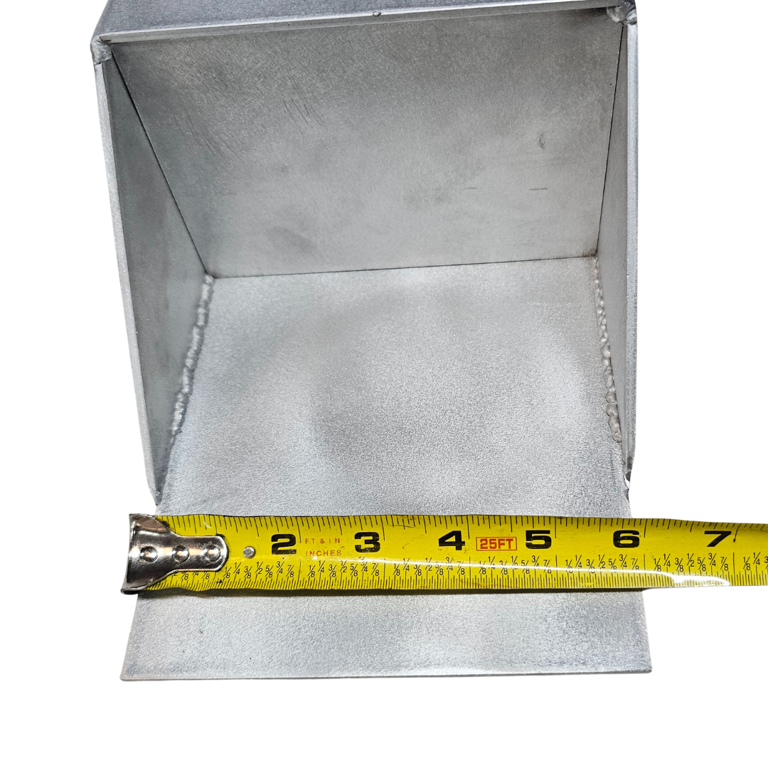 Raw aluminum universal clamp-on trolling motor mount with a tape measure showing its 7-inch width.