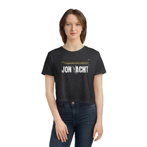 Woman wearing a dark gray flowy cropped tee with "JON YACHT" text and a boat graphic.