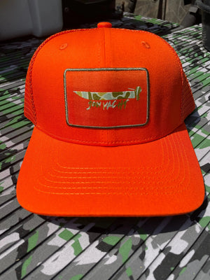 Bright orange trucker hat with a green-bordered patch featuring a camouflage knife and "Jon Yacht" text.