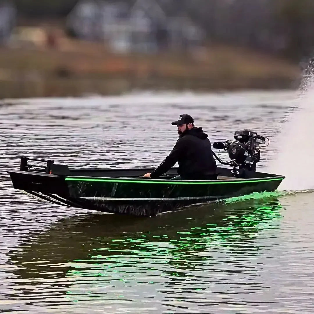 Custom Espresso over Black 1436 duck boat with green LED lights, 13hp mud motor, and driver on water.