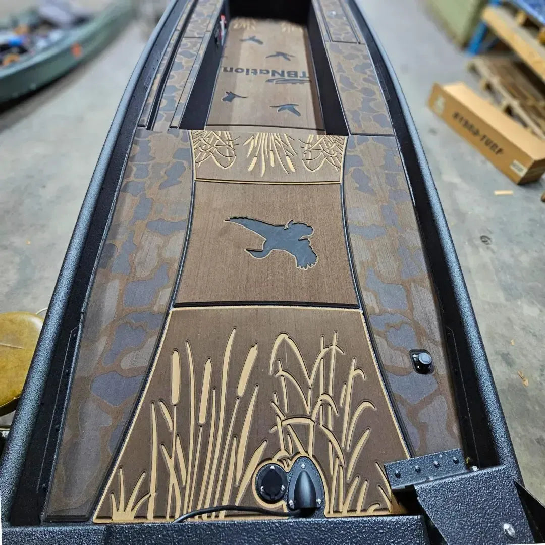 Espresso over black 1436 custom duck boat with laser-engraved HydroTurf featuring duck and cattail designs.
