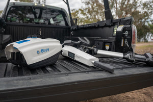 Bixpy device on a truck bed with a blurred background