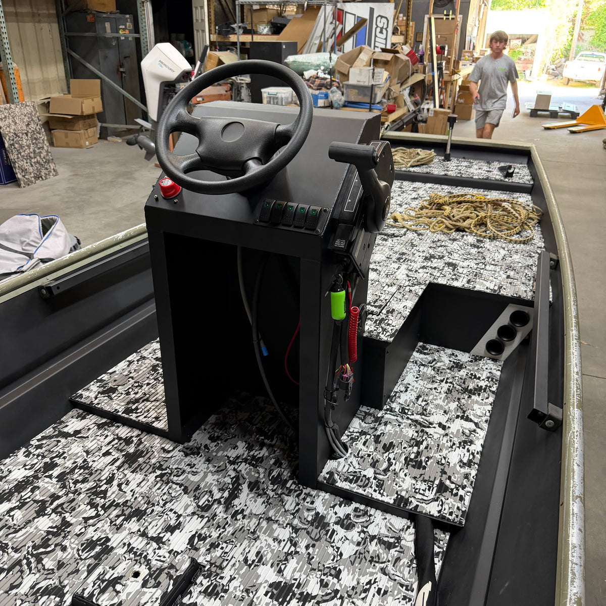 Control panel with steering wheel on a vehicle platform in an outdoor setting