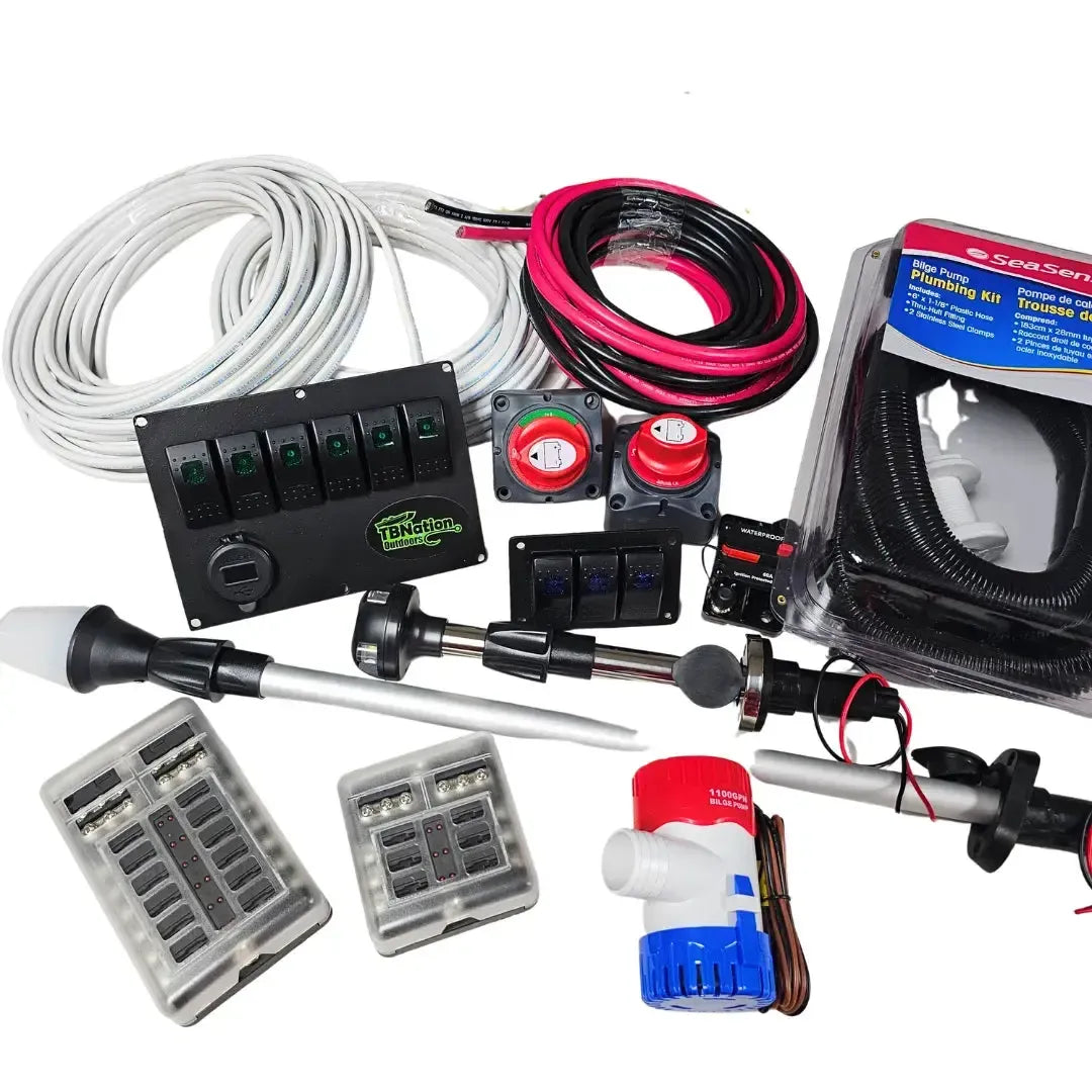 Assortment of electrical and plumbing boat components including white and red/black wires, fuse boxes, switches, and a bilge pump.
