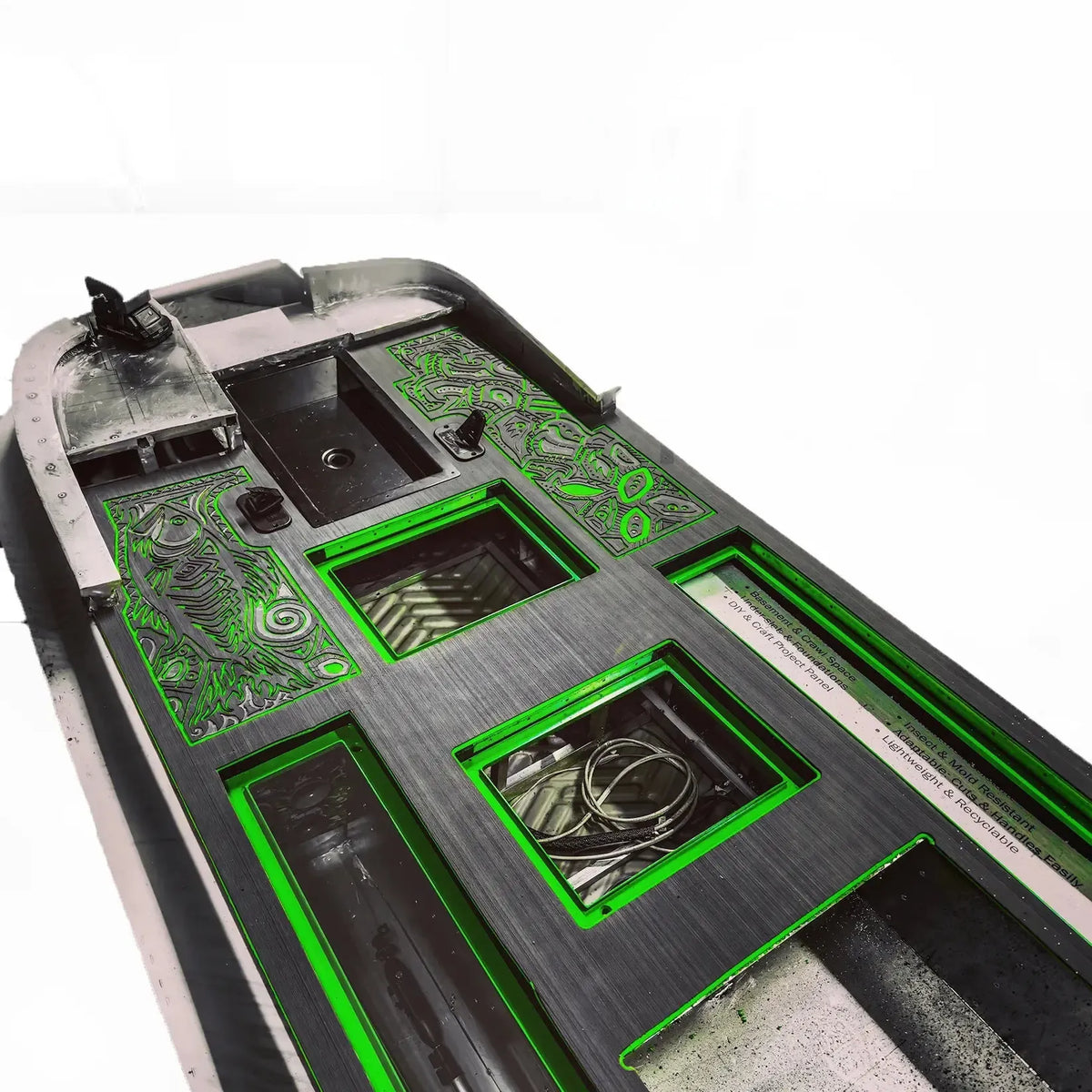 HydroTurf two-tone black and green EVA foam decking with custom routed designs on a boat floor.