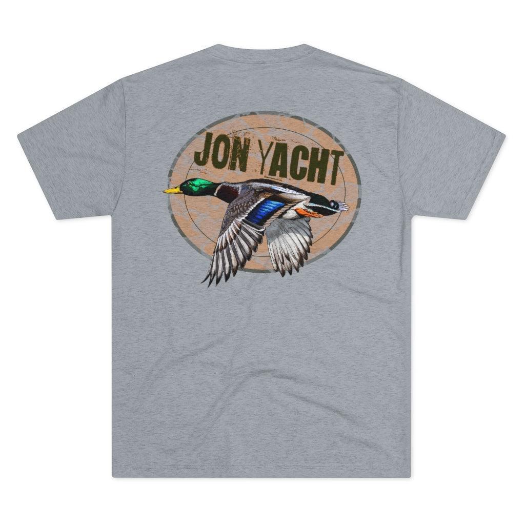 A heather gray short-sleeve t-shirt showing the back side, which features a large graphic print of a flying mallard duck inside a tan circle with the text 'JON YACHT'.