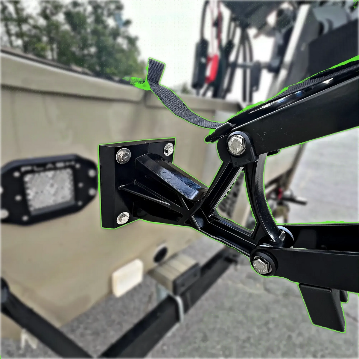 Black Lewmar Vector manual shallow water anchor mounted on a tan boat transom.
