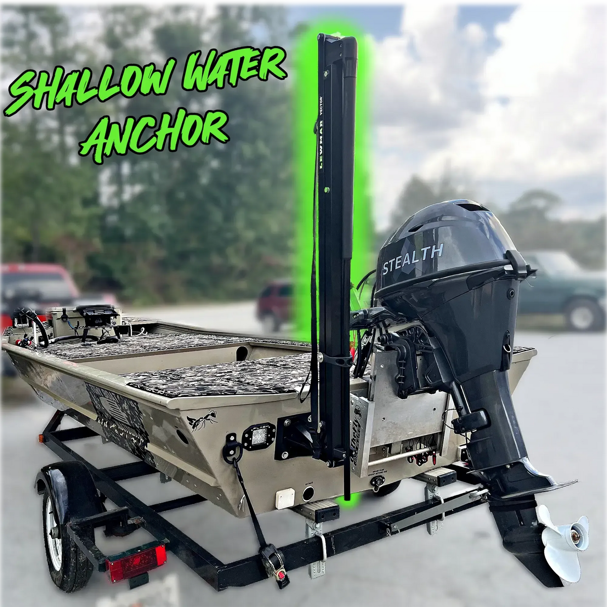 Black Lewmar Vector manual shallow water anchor mounted on the transom of a camouflage jon boat.