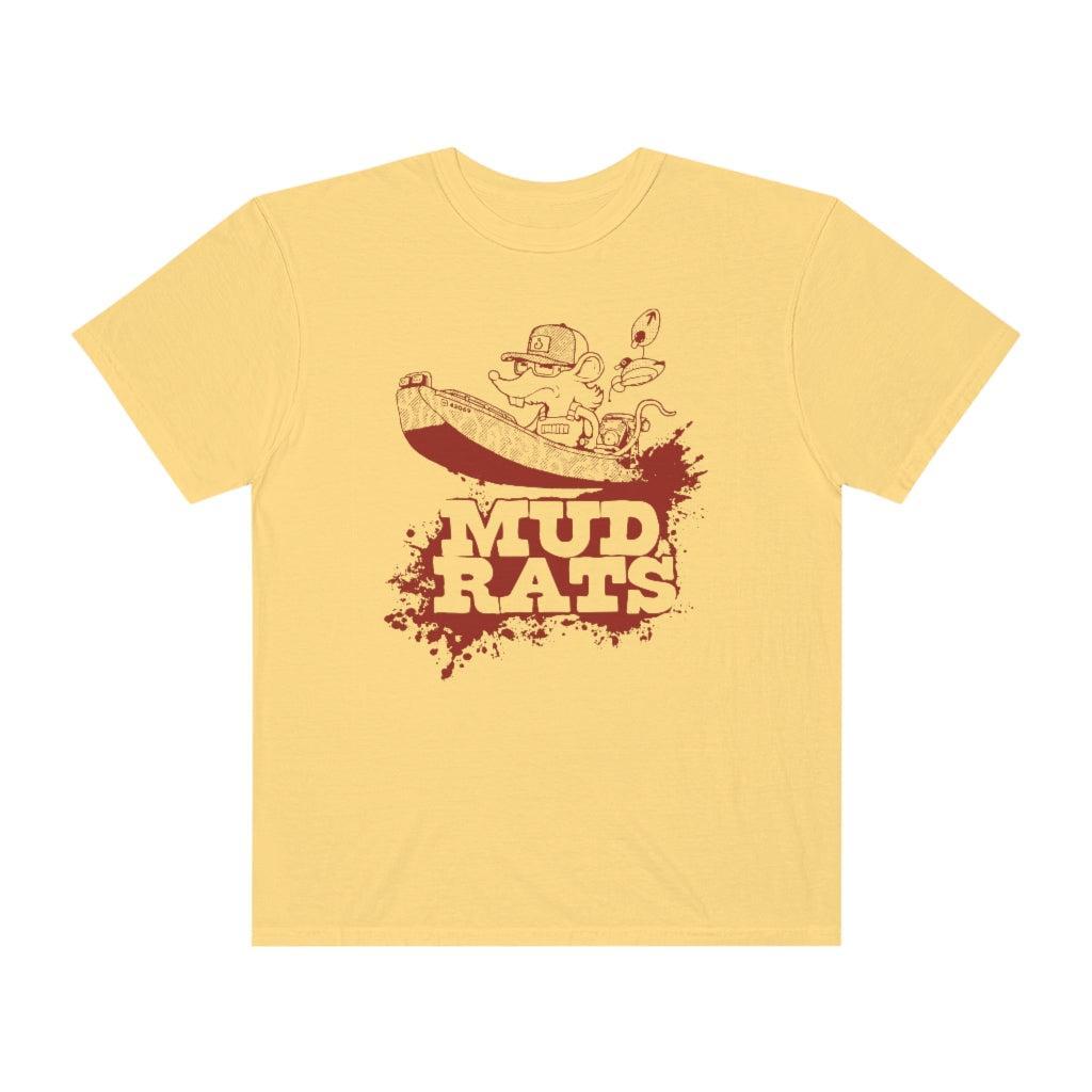 A pale yellow short-sleeve t-shirt with a brown graphic of a cartoon character in a boat above the text 'MUD RATS' on a white background.