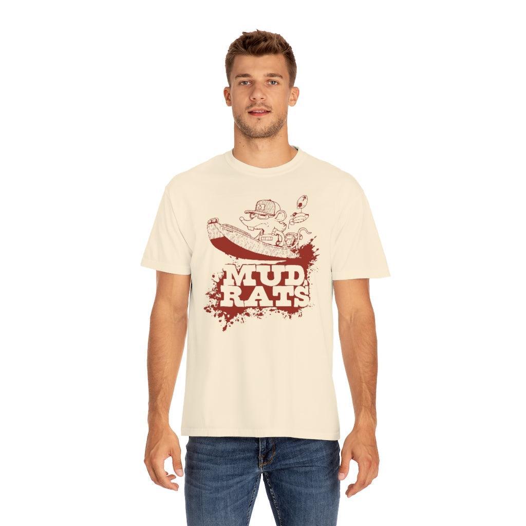 A man wearing a cream-colored t-shirt with a red and brown 'Mud Rats' graphic on the front, paired with blue jeans, set against a plain white background.